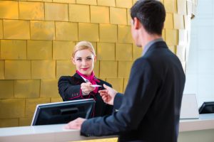 concierge giving guest key concierge giving guest key