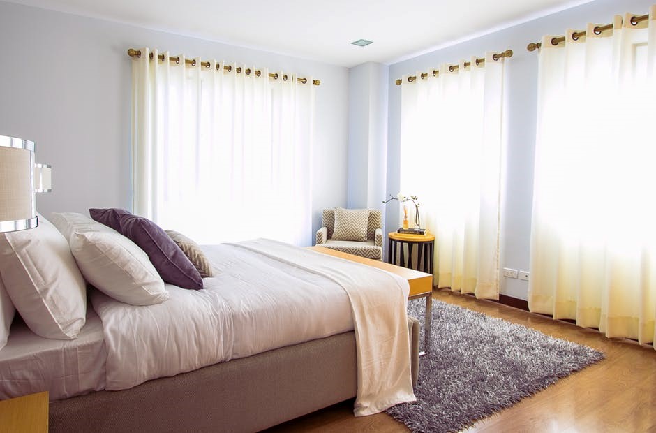 hotel room with light curtains